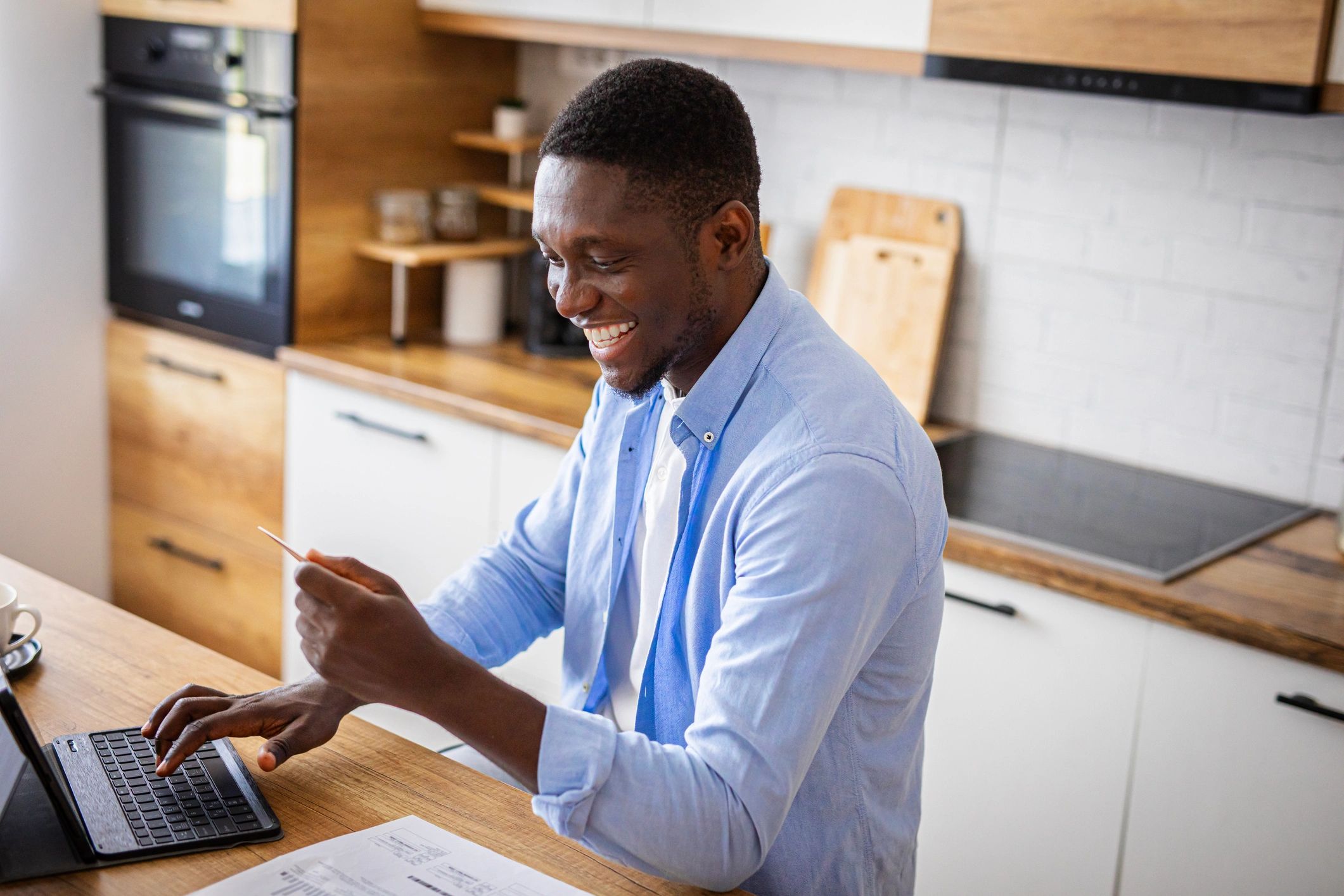 Customer using a laptop to review and pay bills